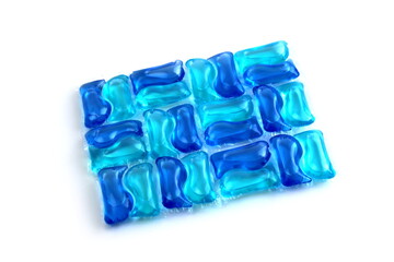 Abstract background of bright blue laundry capsules.