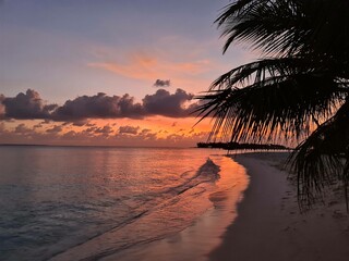 Amazing sunset in the Maldivian Islands, Indian ocean view. Paradise.