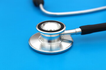  the stethoscope lies on a blue background. The topic is medicine.