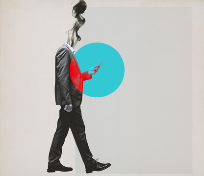 Distracted businessman walking and staring at his smartphone