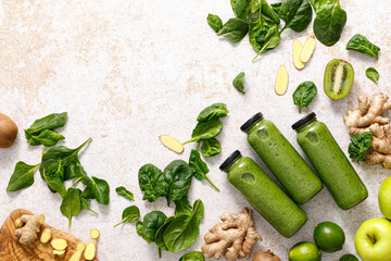Smoothie. Healthy fresh raw detox spinach smoothie with green apple, kiwi and ginger in a bottles...
