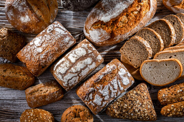 Assorted bakery products including loaves of bread and rolls