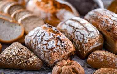 Assorted bakery products including loaves of bread and rolls