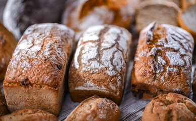 Assorted bakery products including loaves of bread and rolls