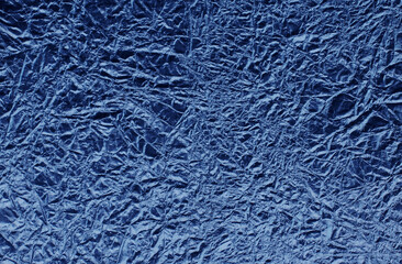 Blue texture of crumpled foil.