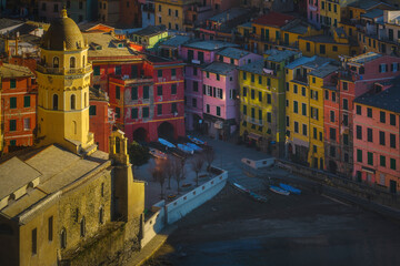 Fototapeta premium Aerial view of Vernazza church and old town at sunset. Cinque Terre, Italy