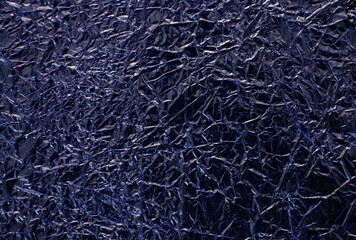 Abstract crumpled blue foil background.