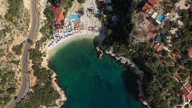Aerial view of beautiful beach with turquoise bay. Buyuk cakil beach in Kas city, Turkiye