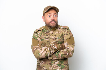 Military man isolated on white background making doubts gesture while lifting the shoulders