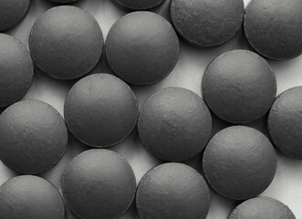 Close-up monochrome image of medical pills.