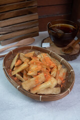 tela tela is a food originating from Indonesia which is made from fried cassava and sprinkled with balado seasoning powder