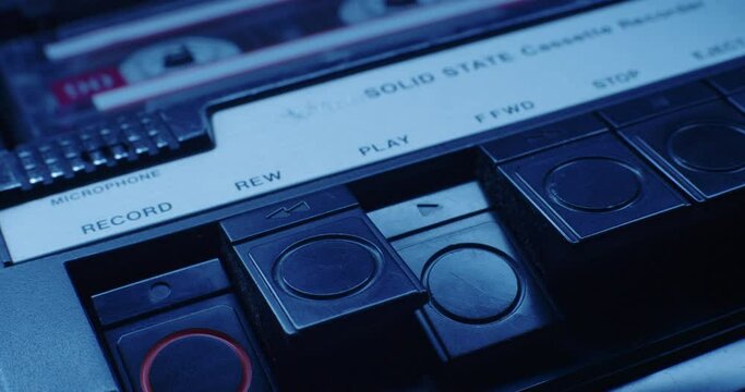 Close-Up Of Cassette Player Record Button Pressed In Blue Light