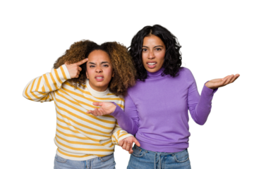 Two female friends isolated in studio showing a disappointment gesture with forefinger.