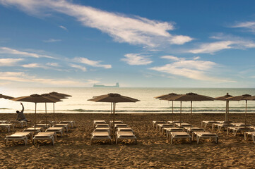 Young man enjoying a sunny day at postiguet beach in alicante, spain