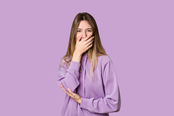 Young blonde posing for a portrait isolated, exuding natural beauty and radiance laughing happy,...