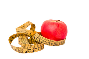 Measuring tape and red apple isolated on white background