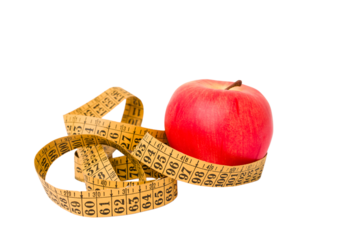 Measuring tape and red apple isolated on white background