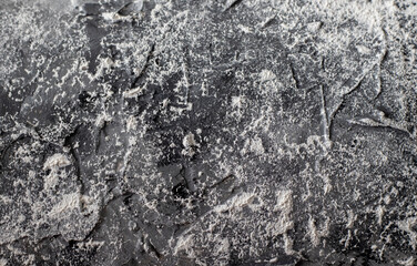 Rough texture of black, gray and white putty on the wall. Marble texture effect