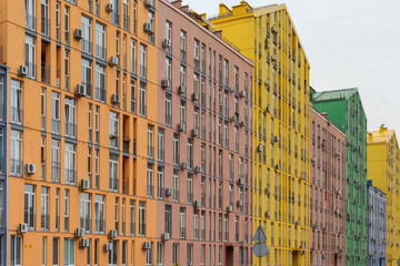Colored facades of modern multistory apartment buildings