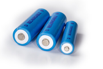 Rechargeable nickel metal hydride batteries different sizes close-up - obrazy, fototapety, plakaty