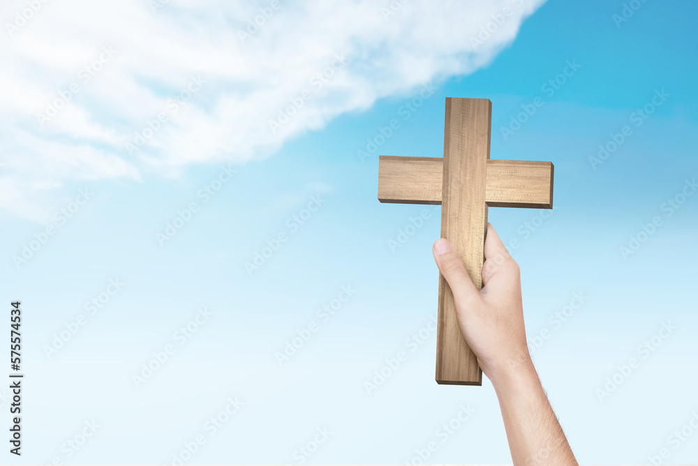 Poster human hand holding christian cross