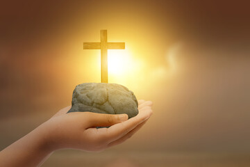 Human hand showing Christian cross
