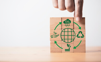 Hand stacking world and CO2 reducing ,Recycle ,Green factory icon for decrease CO2 , carbon...