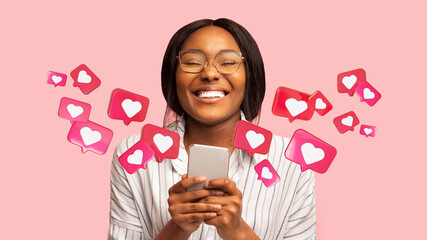 Happy young african american woman has romantic chat with hearts on phone, enjoys message, good news
