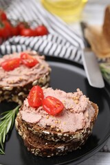 Fototapeta na wymiar Delicious liverwurst sandwiches with tomatoes on table, closeup