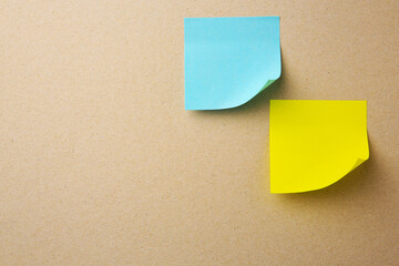 Blank paper notes on beige background, flat lay. Space for text