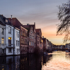 Obraz premium Canal houses in Ghent, Belgium during sunset