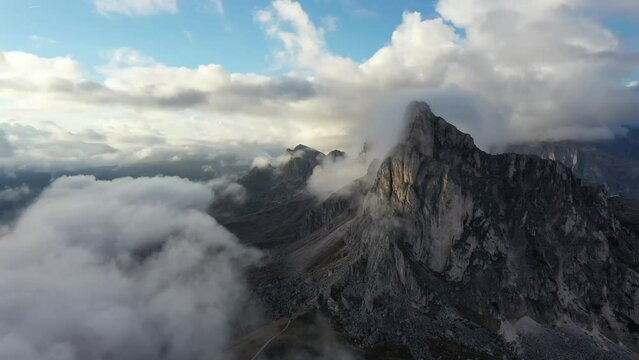 Tracking drone video showing low level clouds covering the Dolomites, Italy 