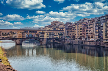Obraz premium the old bridge, symbol of the city of Florence, the cradle of the Italian Renaissance and the capital of Tuscany in Italy, in August 2016