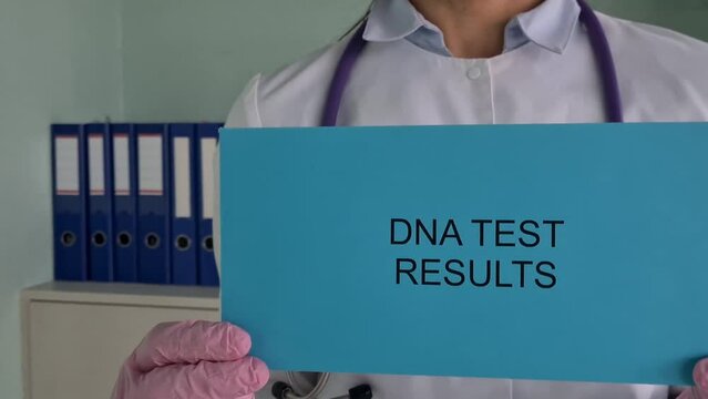 Doctor holds envelope with results of dna genetic study. Paternity test