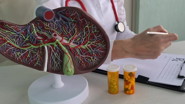 Liver problem with colorful medical pills closeup. Doctor medicines and liver treatment