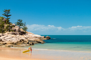 Calm surf and Lifeguard on empty beach at Magnetic island, Australia