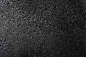 Drops of water on a black background.