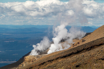 Fototapeta na wymiar Geothermal activity steam from vulcanon at Tongariro Alpine Crossing