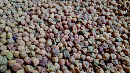 Close up click of raw sun-dried brown chickpeas (chana)