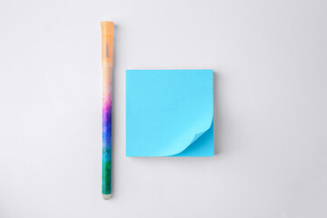 Blank paper note and pen on white background, flat lay