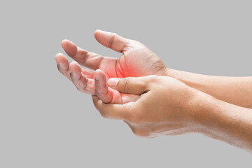 Pain in the palm of hand caused by bruising or injuring, Isolated on a gray wall background. - obrazy, fototapety, plakaty