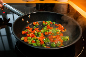Portrait of cooking vegetables in a frying pan