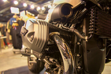 Detailed view of the engine and exhaust of a motorcycle with a transverse boxer engine