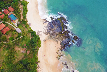 Naklejka na ściany i meble Aerial view of a tropical hotel, villa spa for luxury relaxation. Beautiful tourist wallpapers for for advertising. Asian landscape, photo from the drone