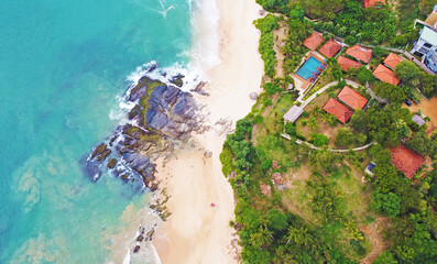 Obraz na płótnie Canvas Aerial view of a tropical hotel, villa spa for luxury relaxation. Beautiful tourist wallpapers for for advertising. Asian landscape, photo from the drone