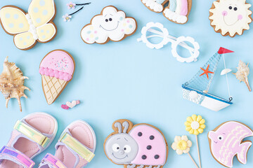 Bright creative layout made of cute summer symbols with copy space on blue background. Top view, Flat lay. Creative summer concept