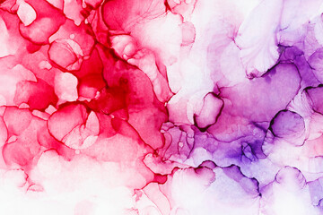 Macro close-up of red and purple alcohol ink layers and splashes, abstract background. Fluid ink, colorful full frame textured background. Vibrant colors. Art for design.
