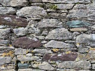 Natural colours and textures of a stone wall.