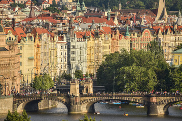 City view with sideview of the Charles bridge and houses in the background, Prague, zech republic