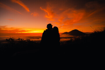 Couple kissing on the Mount Batur in Bali, Indonesa